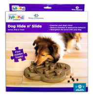 Outward Hound Nina Ottoson Dog Hide n Slide Composite  The Nina Ottosson by Outward Hound Interactive Dog Hide N' Slide puzzle game is a fun way to engage your dog's mind and activate their problem solving-skills. This level 2 intermediate puzzle dog toy comes with two types of hiding spots for snacks or kibble for a total of 14 treat compartments: under the swivelling flippers and in the hollow