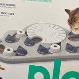 Rainy Day Puzzle & Play- Interactive Cat Treat Puzzle  * great for curious cats, stimulates natural foraging instincts  * use for feeding daily to encourage a healthy eating place  * 14 hidden treat cups designed with cats in mind  * skill level = advanced  * eco friendly material  * adjust the difficulty of the puzzle to keep challenging your cat  * specifically designed for cats with shallow treat cups  * easy to clean  * no removeable parts for safer play  * made with food safe material